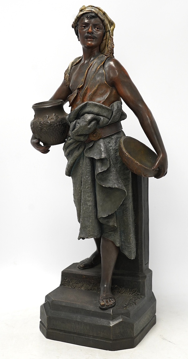 A large Austrian cold painted terracotta figure of a street seller, 59cm high. Condition - fair to good, minor chips